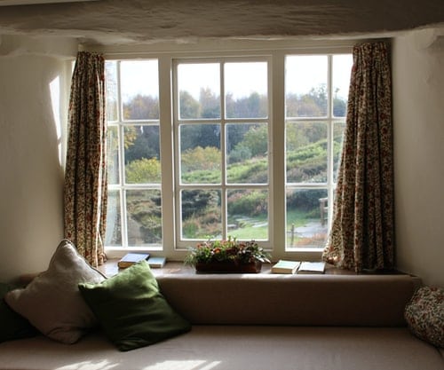 A window and curtains indoors.
