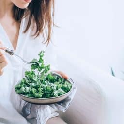 Woman eating a healthy salad.