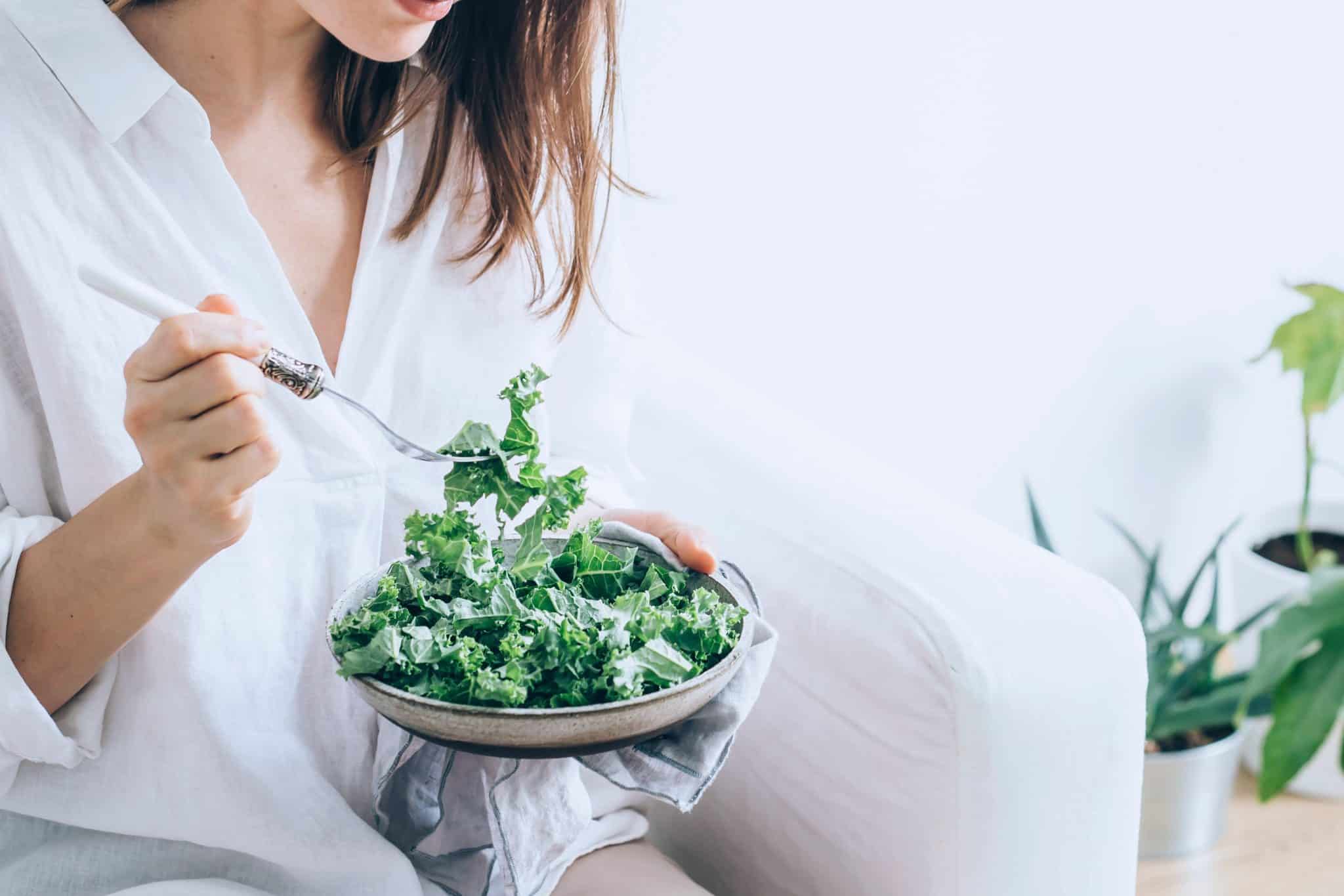 Woman eating a healthy salad.