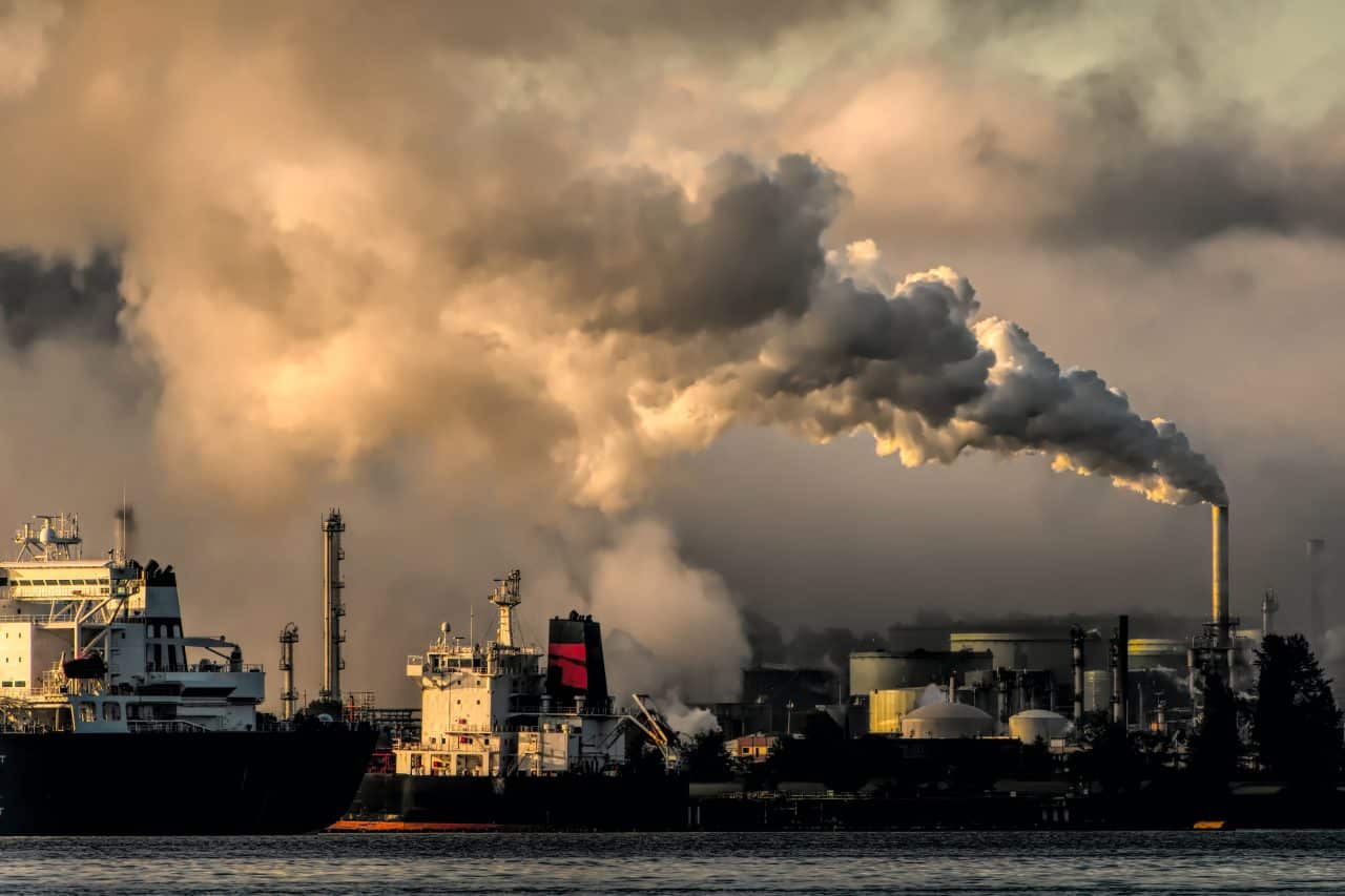 Factory billowing smoke into the air causing air pollution.