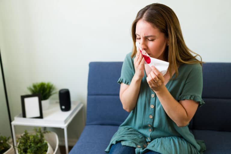 Woman-leaning-forward-with-a-nosebleed-768x512.jpg