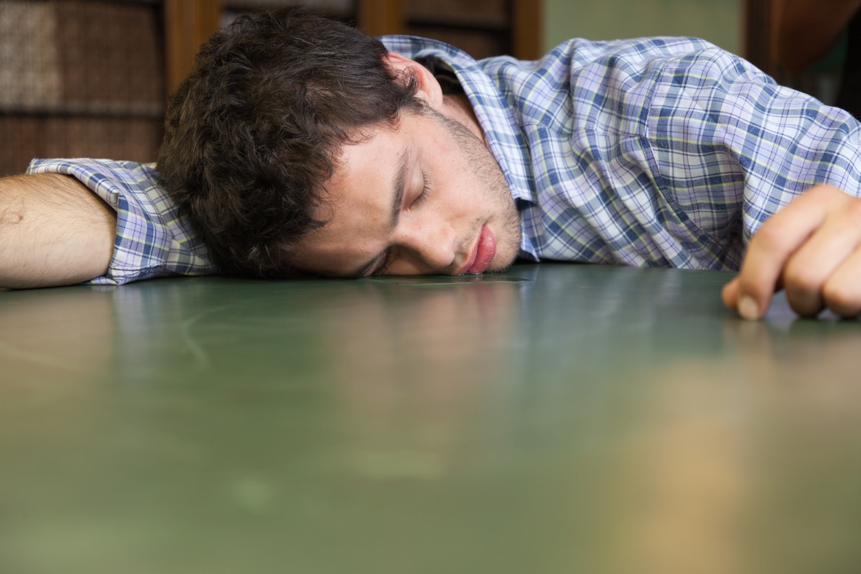 Student drooling on a desk.