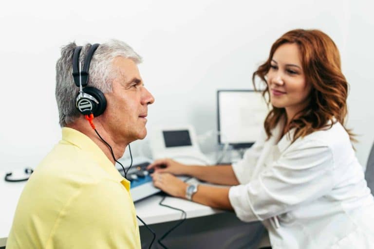 audiology patient completing hearing test